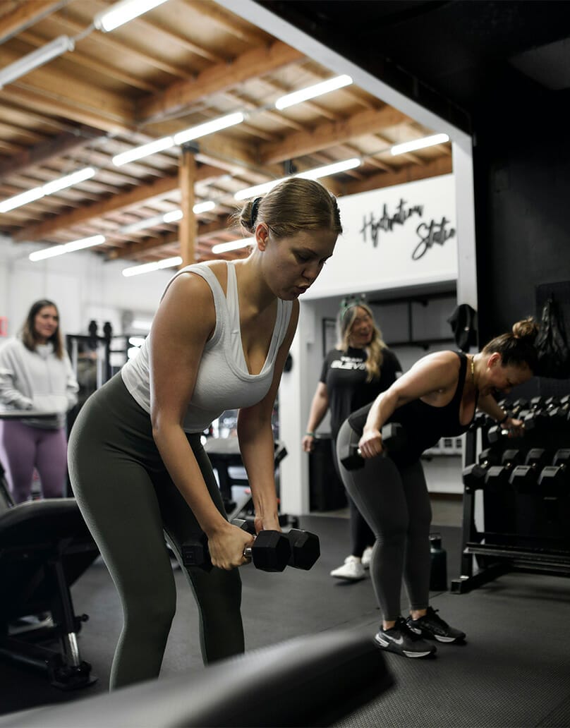 Women training with small weights at Elev8 Performance